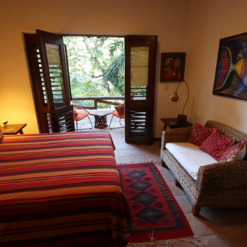Guest Bedroom with Outdoor Seating Area in Playacar Mexico